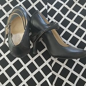 Black, clasped, heels.